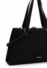 Black tote bag made of smooth fabric, featuring two handles and an adjustable strap. Notable details include sleek stitching and a gold logo tag.
