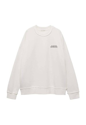 Sweatshirt en coton blanc avec des manches longues, col rond et poignets côtelés. Présente un texte en détail à l'avant, une coupe décontractée et des accents de couture minimalistes.