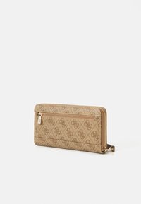 Brown patterned wallet with gold hardware, zip closure, and a textured surface. Features a slim rectangular shape with a secure compartment.