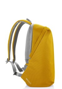 Yellow backpack with grey straps, made of textured fabric. Features a sleek design and a unique shape with a zippered side compartment.