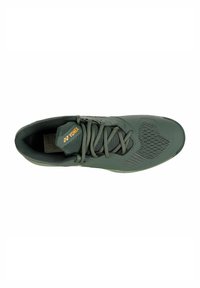 Green athletic shoe with a textured mesh upper, reinforced toe, and flat laces. Features a subtle pattern on the side and a logo label.