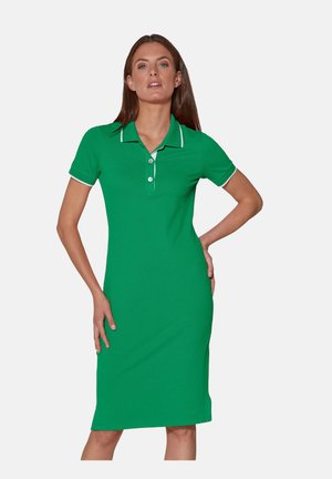 Grünes Polo-Kleid aus Baumwolle mit schlanker Passform. Verfügt über kurze Ärmel, einen Kragen und weiße Akzente entlang des Kragens und der Ärmel.