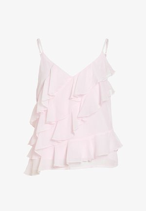 Camisole rose clair sans manches avec volants superposés et fines bretelles ajustables sur fond blanc uni.