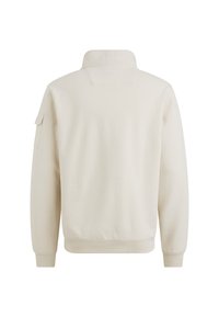 Sudadera de color beige claro con cuello alto, puños acanalados y un bolsillo lateral. Textura suave con un diseño liso y sin patrones visibles.