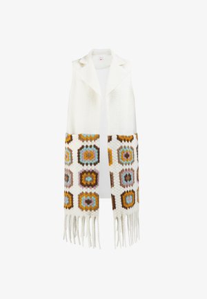 Mouwloos vest in een witte wolmix met veelkleurige geometrische patronen aan de zoom. Kenmerkt zich door franjes, een zachte textuur en een open voorkant.