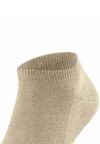 Beżowa skarpetka za kostkę z żebrowaną teksturą, z okrągłym mankietem i gładką powierzchnią. Wykonana z miękkiego materiału, zapewniająca komfortowe dopasowanie.