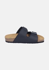 Black slide sandal with dual adjustable buckles, cork footbed, and textured rubber sole for grip. Lightweight design features open toe.