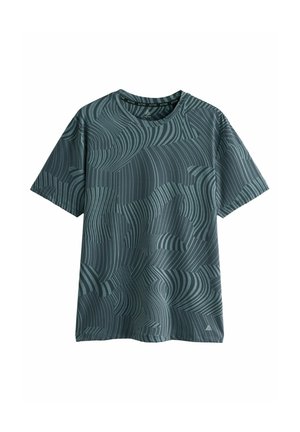 T-shirt à manches courtes, vert-bleu, présentant un motif de vagues dans des teintes plus foncées, avec un col rond et une texture douce. Accents géométriques au niveau de l'ourlet.