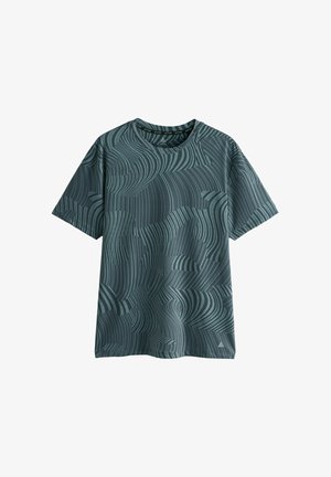 Short-sleeve, greenish-blue T-shirt featuring a wave pattern in darker shades, round neckline, and a soft texture. Geometric accents at the hem.