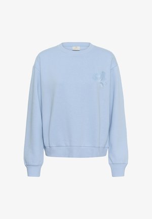 Helehall sinine pusa pehmest kangast, millel on ümmargune kaelus, pikad varrukad ja vasakul rinnal tikkitud roosi detail.