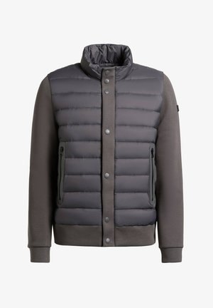 Tummanharmaa toppatakki, jossa vetoketjulliset sivutaskut, nepparikiinnitys, korkea kaulus sekä neulotut hihat ja hihansuut.