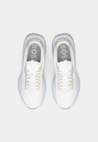 Pair of white and light gray BOSS sneakers with laces, visible branding inside and on the sides, shown from above on a white background.