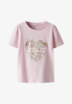 Pink cotton t-shirt with short puff sleeves and a floral heart graphic. Design includes gold accents and text reading "let's grow together."