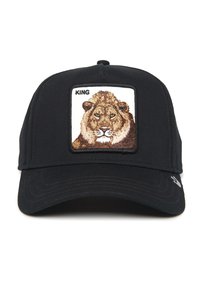 Black baseball cap with a lion embroidery patch featuring the word "KING." The cap has a structured design and a curved brim.