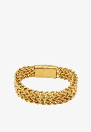 Złota, pleciona bransoletka z płaskim zapięciem. Charakteryzuje się teksturowanym, zaplatanym wzorem, podkreślającym metaliczny blask i zachodzące na siebie ogniwa.