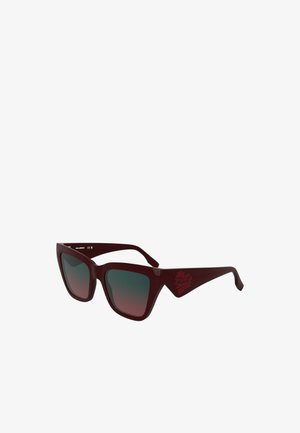 Bordeaux-farbene übergroße Sonnenbrille mit Verlaufslinsen, kantiger Form und Logodetail am Bügel. Glatter Kunststoffrahmen mit breiten Bügeln.