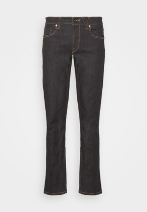 Donkerdenim, uitlopende jeans met oranje stiksels, vijf zakken, ritssluiting en knoopsluiting. Gladde textuur en een getailleerde pasvorm.