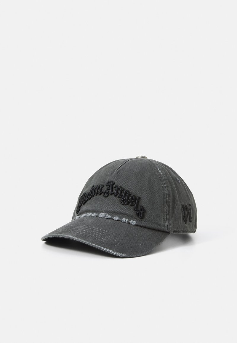 Hallikas puuvillane beebikepike, mille esiosas on must õmmeldud "Palm Angels" logo, kumer visor ja reguleeritav rihm taga.