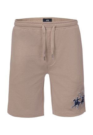 Beżowe casualowe szorty z elastycznym pasem, regulowanym sznurkiem oraz haftowanym granatowym logiem zawodnika polo na dolnej prawej nogawce.