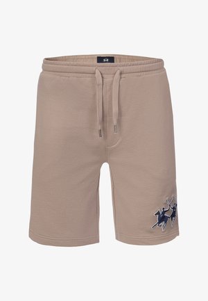 Beige Freizeithosen mit elastischem Bund, verstellbarem Kordelzug und gesticktem dunkelblauem Polo-Spieler-Logo am unteren rechten Bein.