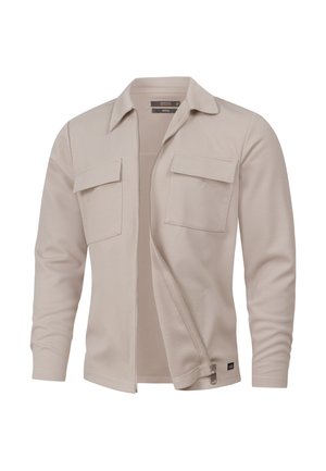 Beige zip-up jack met een gestructureerde stof, voorzien van twee borstzakken en een kraag. Gladde afwerking met lange mouwen.