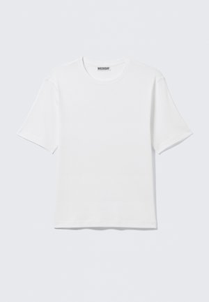 T-shirt blanc uni à manches courtes et col rond, avec une petite étiquette "WEEKDAY" à l'intérieur du col arrière, présenté à plat.