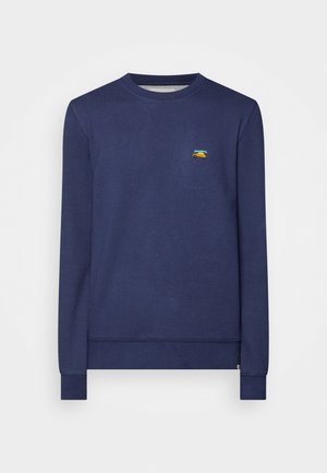 Navyblauwe sweatshirt met een klassieke ronde hals, lange mouwen en geribbelde boorden. Bevat een klein, kleurrijk geborduurd ontwerp op de borst.