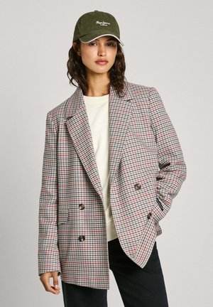 Double-breasted blazer in a check pattern, featuring red and blue lines on a beige background, with two front pockets and button accents.