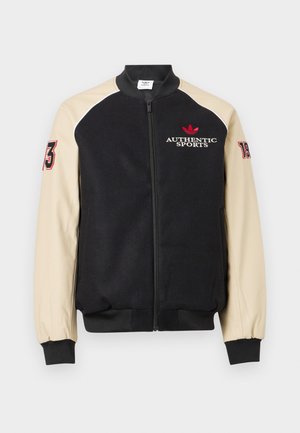 Μαύρο και μπεζ μπουφάν varsity με φερμουάρ μπροστά, κείμενο «AUTHENTIC SPORTS» και κόκκινο λογότυπο στο στήθος, αριθμοί «73» και «19» στα μανίκια.