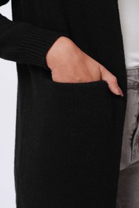 Black knitted cardigan with ribbed cuffs, featuring a side pocket. The fabric texture is soft, and the design is open-front style.