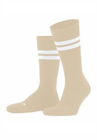 Beige kniehohe Socken mit gerippter Struktur und zwei weißen horizontalen Streifen nahe der Spitze, nebeneinander als Paar dargestellt.