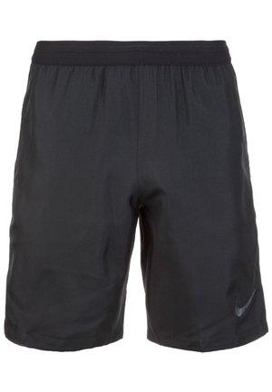 Shorts de sport noirs jusqu'au genou avec taille élastique et petit logo Nike swoosh sur le bas de la jambe droite.