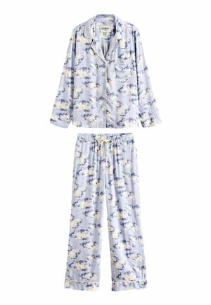 Hellblaue Pyjama-Bluse aus weichem Stoff, mit einem floralen Muster in Weiß, Lila und Gelb. Die Bluse hat eine Tasche und einen Knopfverschluss.