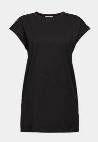 T-shirt noir à manches courtes décontracté avec un col rond et des revers de manches légèrement roulés sur un fond uni.