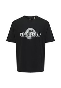 Camiseta de algodón negra con impresión gráfica de una luna y el texto "PINK FLOYD" con los detalles de la gira debajo, de mangas cortas y cuello redondo.