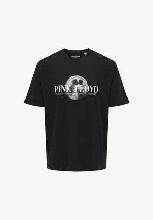 Camiseta de algodón negra con impresión gráfica de una luna y el texto "PINK FLOYD" con los detalles de la gira debajo, de mangas cortas y cuello redondo.