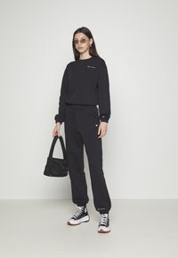 Champion Rochester ELASTIC CUFF PANTS - Treningo apatinė dalis - black