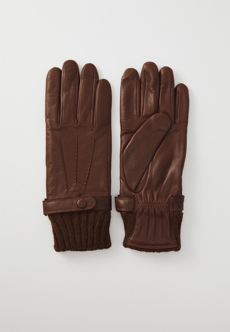 Une paire de gants en cuir marron avec des poignets tricotés et des sangles à bouton-pression, montrant les vues avant et arrière sur un fond blanc.