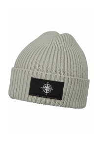 Light gray knitted beanie with a ribbed texture. Features a black rectangular patch displaying a white compass design.