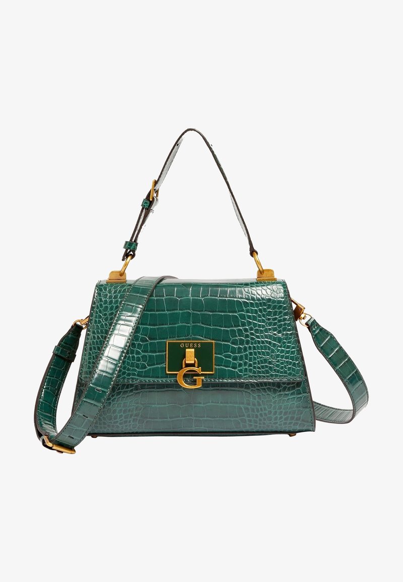 Sac à main vert en cuir embossé crocodile avec quincaillerie dorée, plaque logo "GUESS", poignée supérieure et bandoulière ajustable.