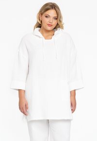 Witte lange mouwen pullover in een textuurstof, met een capuchon, een zak aan de voorkant en opgerolde mouwen voor een relaxte pasvorm.