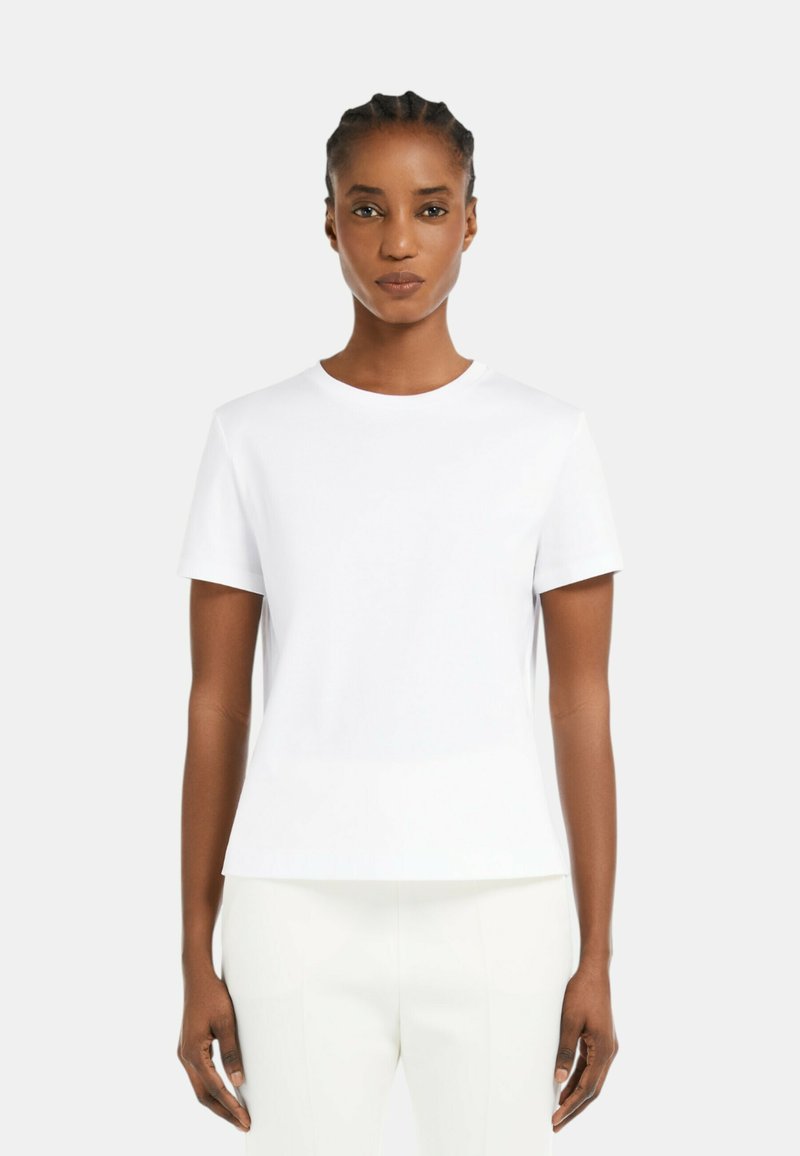 T-shirt bianco a maniche corte con scollatura rotonda, realizzato in tessuto morbido, con taglio dritto e design minimalista.
