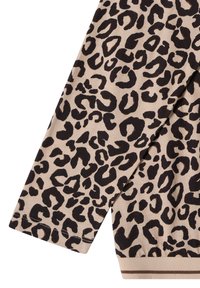 Maglia a maniche lunghe con stampa leopardata, realizzata in un tessuto beige con macchie nere, polsini a costine e un dettaglio a contrasto sull'orlo. Texture morbida.