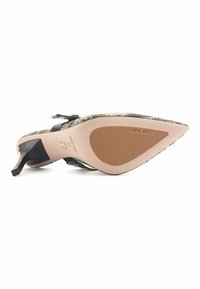 Pointed-toe heeled shoe with a snake print texture, black accents, and a cream-colored sole. The brand "NINE WEST" is embossed on the sole.