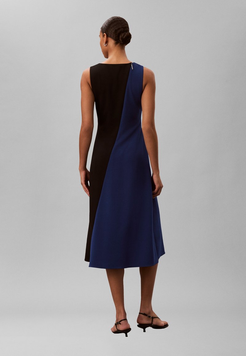 calvin klein blue and black dress Wrap Around S neck that enhances the flattering silhouette Calvin Klein Color Block Black