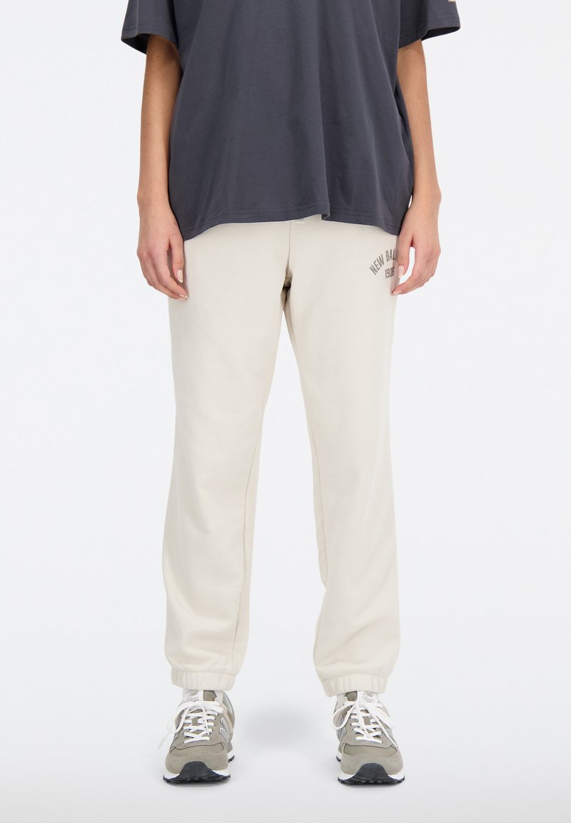 New Balance Trainingsbroek goudkleurig