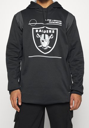 Felpa nera con cappuccio realizzata in tessuto liscio, caratterizzata da un grande logo dei Raiders, dettagli bianchi e un design a strisce sulle spalle. Maniche lunghe.