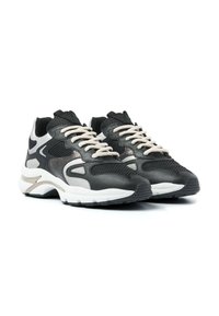 Black and gray athletic sneakers with mesh fabric, contrasting leather accents, cream laces, and a thick white sole featuring traction grooves.