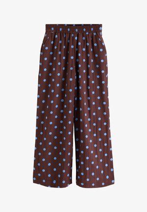 Barna, széles szárú nadrág világoskék pöttyökkel, elasztikus derékpánttal, elülső redőkkel és oldalzsebekkel.