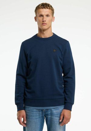 Navyblaues Sweatshirt aus strukturiertem Stoff, mit Rundhalsausschnitt und langen Ärmeln. Enthält ein kleines Logo-Patch auf der Brust.